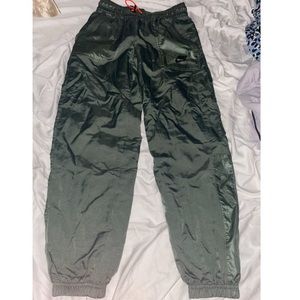 green elastic nike joggers
